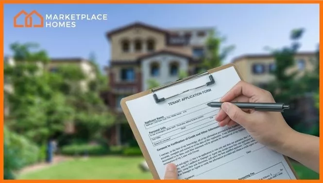 property manager holding a rental application for tenant screening